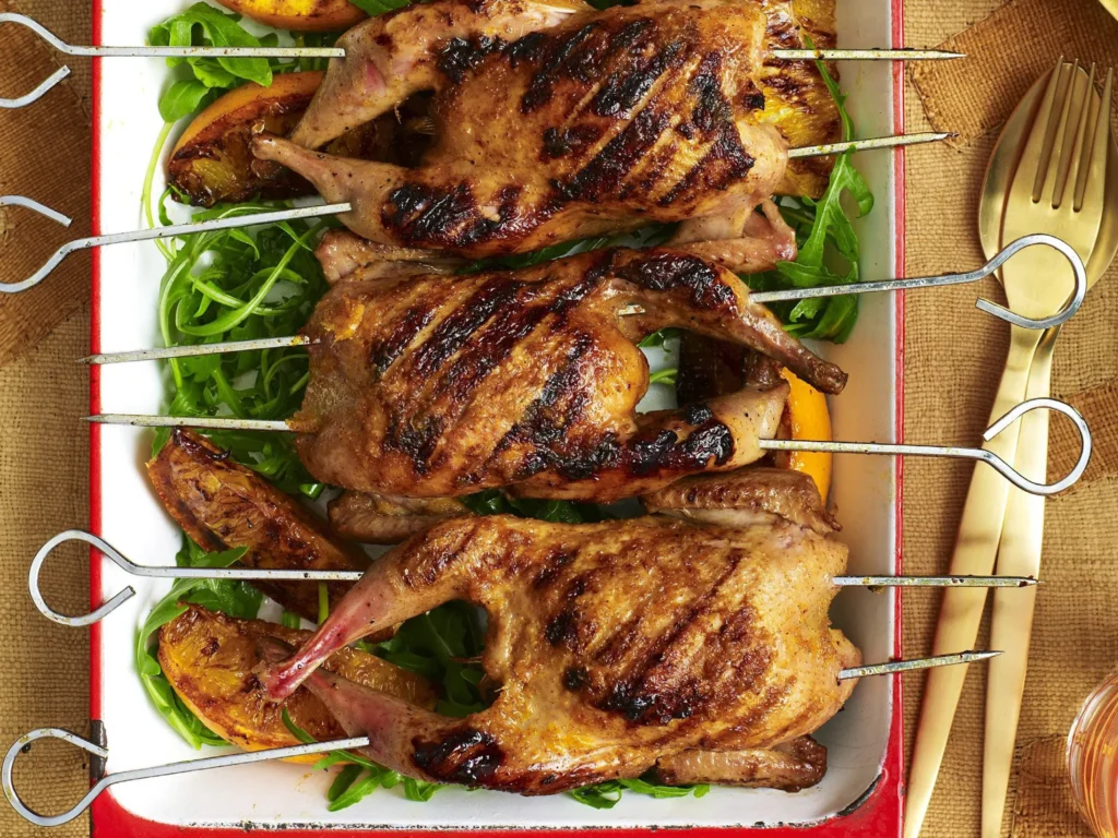 Butterflied Quail with an Orange image