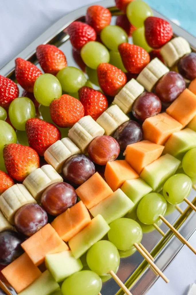 17 Birthday Party Snacks Ideas That Make Planning Easy, Fun, and Stress-Free 3 colourful fruit skewers with strawberrie 8KthlBygRpCIo6fRo08e8A pXpPuAwXT Wk uPuGDDowQ cover